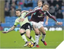  ??  ?? ■ Bournemout­h’s Harry Arter tackles Jeff Hendrick.