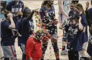  ?? MORRY GASH — THE ASSOCIATED ORESS ?? UConn head coach Geno Auriemma is dunked with confetti after his team’s 69-67 win over Baylor at the Alamodome in San Antonio on Monday, March 29.