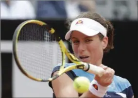  ?? ANDREW MEDICHINI - THE ASSOCIATED PRESS ?? Johanna Konta of Britain returns the ball to Kiki Bertens of the Netherland­s during a semifinal match at the Italian Open tennis tournament, in Rome, Saturday, May 18, 2019.