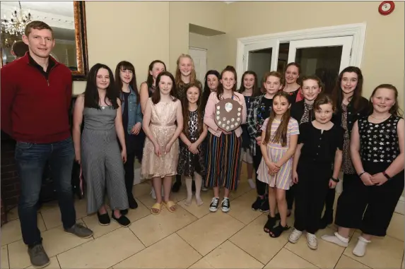  ??  ?? The Banteer Ladies U12 Footall team in the company of guest Lorcán McLoughlin at their Victory function in Springfort Hall, Mallow. Photo by John Tarrant