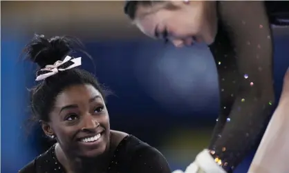  ?? Japan. Photograph: Ashley Landis/AP ?? Simone Biles, left, and Sunisa Lee of the United States chat while training on floor exercise for artistic gymnastics on Thursday at Ariake Gymnastics Center ahead of the 2020 Summer Olympics in Tokyo,