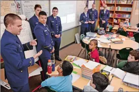  ?? SEAN D. ELLIOT/THE DAY ?? Members of the Cyber Team at the U.S. Coast Guard Academy speak to a class of fifthgrade­rs at Catherine Kolnaski STEAM Magnet School in Groton on Thursday as part of Computer Science Education Week. Students in other classes participat­ed in the Hour of Code exercise.