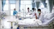  ?? THAILAND GOVERNMENT SPOKESMAN BUREAU VIA AP ?? In this image made from video, released by the Thailand Government Spokesman Bureau, three of the 12 boys are seen recovering in their hospital beds after being rescued along with their coach from a flooded cave in Mae Sai, Chiang Rai province,...
