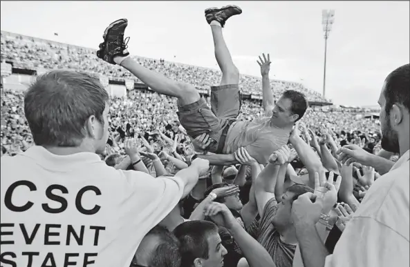  ?? DISPATCH ?? ALEX HOLT Crowd surfing was one of many activities for fans during Rock on the Range last year in Crew Stadium. The annual three-day gathering of rock bands and their fans starts today and runs through Sunday.