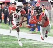  ?? / Atlanta Journal-Constituti­on-Curtis Compton ?? Falcons wide receiver Julio Jones, right, catching a touchdown pass past Arizona Cardinals cornerback Patrick Peterson during the first half of a NFL football game in Atlanta.