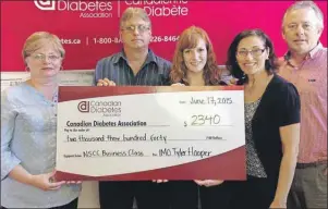  ?? SUBMITTED BY ARLENE PARSONS ?? Arlene Parsons, from left, Cape Breton branch co-ordinator for the Canadian Diabetes Associatio­n, accepts a cheque in memory of Tyler Hooper from Nova Scotia Community College classmates Rob Bourque and Elizabeth Arsenault while Hooper’s parents, Betty...