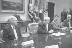  ?? NICHOLAS KAMM, AFP/ GETTY IMAGES ?? President Trump meets with Senate Majority Leader Mitch McConnell, left, House Speaker Paul Ryan and Senate Majority Whip John Cornyn at the White House on June 6.