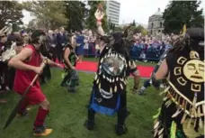  ?? JONATHAN HAYWARD/THE CANADIAN PRESS ?? The royal couple watch First Nations dancers in Victoria.