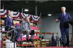  ?? ANDREW HARNIK — THE ASSOCIATED PRESS ?? President Joe Biden speaks at United Performanc­e Metals in Hamilton, May 6. Sen. Rob Portman, R-Ohio, left, and Sen. Sherrod Brown, D-Ohio, second from left, listen.