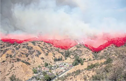  ?? REUTERS ?? Fire rages over La Tuna Canyon in Burbank, California, on Saturday.