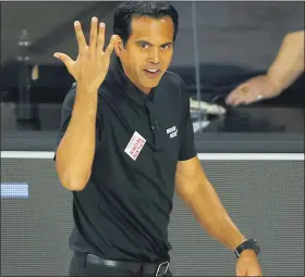  ?? KEVIN C. COX — THE ASSOCIATED PRESS ?? Miami Heat head coach Erik Spoelstra, usually seen on the sideline wearing designer suits, is among the coaches adopting a more casual look since the NBA season resumed.