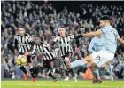  ??  ?? Sergio Aguero scores from the spot