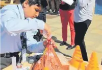  ??  ?? ● Year 7 pupil and third placed Mubashir, whose project was all about volcanoes.