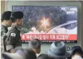  ?? PICTURE: AP ?? TESTING TIME: South Korean army soldiers watch a TV news programme at Seoul Railway Station showing a file image of a missile being test-launched by North Korea.