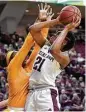  ?? Laura McKenzie / Bryan-College Station Eagle ?? Texas A&M’s Jasmine Lumpkin, right, shoots over Tennessee’s Cheridene Green at Reed Arena in College Station.