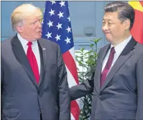  ?? AP PHOTO ?? In this July 8 photo, U.S. President Donald Trump, left, and Chinese President Xi Jinping arrive for a meeting on the sidelines of the G-20 Summit in Hamburg, Germany. After a cordial meeting between Trump and Xi in April, tensions are simmering again...