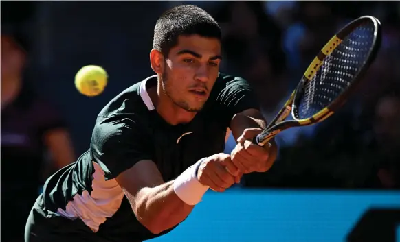  ?? AFP ?? Carlos Alcaraz on his way to beating world No 1 Novak Djokovic in the semi-final of the Madrid Open. The Spaniard outclassed Alexander Zverev in the final