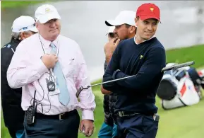  ??  ?? Right
Mcfee and Jordan Spieth discuss a ruling during the 2017 Presidents Cup.