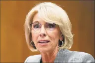  ?? Carolyn Kaster / Associated Press file photo ?? Facing a federal lawsuit and mounting pressure to act, Education Secretary Betsy DeVos on Friday said she will forgive loans for more than 1,500 borrowers who attended a pair of forprofit colleges that shut down last year.