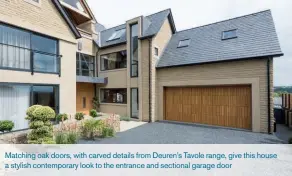  ??  ?? Matching oak doors, with carved details from Deuren’s Tavole range, give this house a stylish contempora­ry look to the entrance and sectional garage door