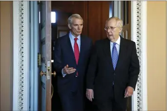  ?? PATRICK SEMANSKY — THE ASSOCIATED PRESS ?? Sen. Rob Portman, R-Ohio, left, talks with Senate Majority Leader Mitch McConnell of Ky., Thursday on Capitol Hill in Washington.