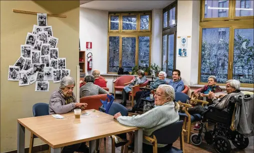  ?? PHOTOS BY ELISABETTA ZAVOLI/NEW YORK TIMES ?? A nursing home in Piacenza illustrate­s what Italy is facing. The government recently approved a program expected to lay a foundation for health and social overhauls for an exploding population of old people. Italy is also seen as a laboratory for Western countries with aging population­s.