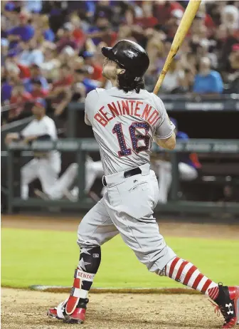  ?? AP PHOTO ?? JUST ENOUGH EXTRA: Andrew Benintendi watches as his hit drops just into the outfield for the go-ahead two-run single in the 11th inning that lifted the Red Sox to a 7-5 victory against the Rangers in Arlington, Texas.