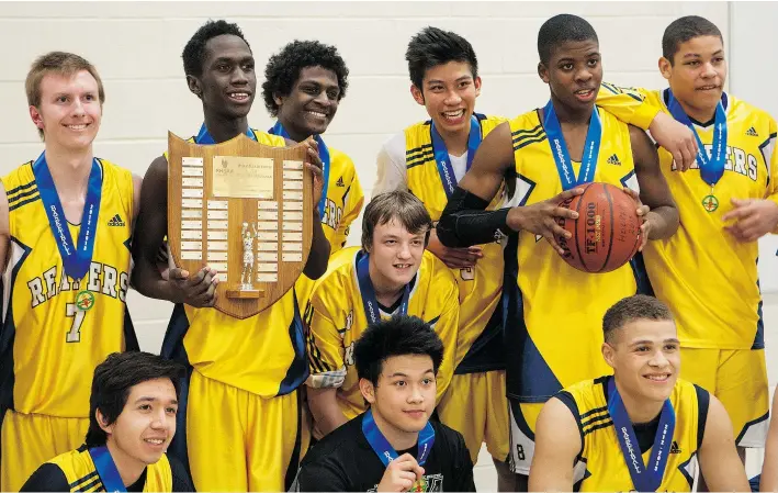  ?? QC PHOTO BY RICHARD MARJAN ?? Regina Harvest City Christian Academy celebrates its win in the 2A boys final at Evan Hardy Collegiate in Saskatoon in 2013.