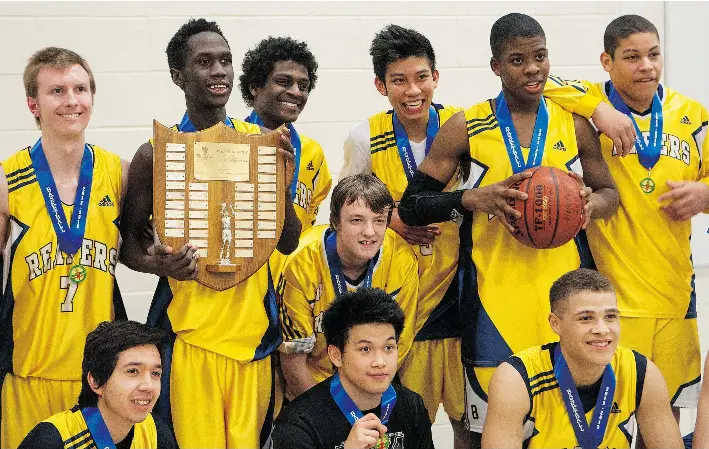  ?? QC PHOTO BY RICHARD MARJAN ?? Regina Harvest City Christian Academy celebrates its win in the 2A boys final at Evan Hardy Collegiate in Saskatoon in 2013.