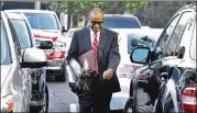  ?? HYOSUB SHIN / HSHIN@AJC.COM ?? Elvin “E.R.” Mitchell Jr. walks to the federal court Tuesday morning. He was sentenced to five years in prison for his role in the Atlanta City Hall bribery scheme.