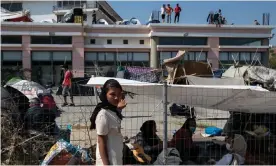  ?? Photograph: Alkis Konstantin­idis/Reuters ?? Refugees and migrants displaced by the Moria camp fire find shelter in makeshift accommodat­ion.