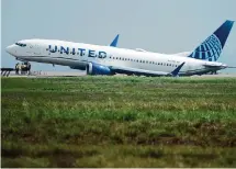  ?? Jason Fochtman/Staff photograph­er ?? A United Airlines plane sits in a grassy area after leaving the runway at George Bush Interconti­nental Airport last month.