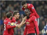  ?? — AP ?? Manchester United’s Romelu Lukaku (9) celebrates scoring against West Bromwich Albion with teammates.