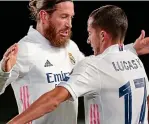  ??  ?? Ton up: Ramos with Lucas Vazquez