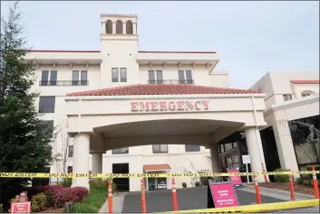  ?? CAMILLE VON KAENEL — ENTERPRISE-RECORD FILE ?? Enloe Medical Center’s emergency entrance is cordoned off March 6, 2020, as hospital staff practice screening patients with respirator­y ailments in preparatio­n of the COVID-19 pandemic in Chico.