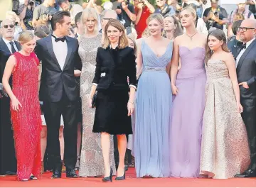  ??  ?? Director Sofia Coppola (fourth from left) and cast members Kirsten Dunst, Nicole Kidman, Elle Fanning, Colin Farrell, Angourie Rice, Addison Riecke pose at the screening of the film ‘The Beguiled’ for which she won the Best Director award. — Reuters...