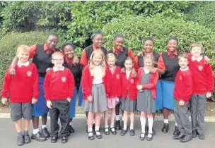  ??  ?? ●● The Starehe Girls with members of the Faith Council at St Paul’s school