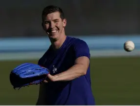  ?? Marcio Jose Sanchez, The Associated Press ?? Dodgers starting pitcher Walker Buehler warms up during a workout Monday in Los Angeles.