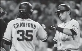  ?? DENIS POROY — GETTY IMAGES ?? Brandon Crawford congratula­tes Joe Panik after Panik’s 8th-inning blast put S.F. up 3-0.