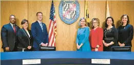  ?? PAUL W. GILLESPIE/CAPITAL GAZETTE ?? Anne Arundel County Council members are sworn in prior to their meeting at the Arundel Center on Dec. 5: Pete Smith, District 1, from left; Allison Pickard, District 2; Nathan Volke, District 3; Julie Hummer, District 4; Amanda Fiedler, District 5; Lisa Rodvien, District 6; and Shannon Leadbetter, District 7.