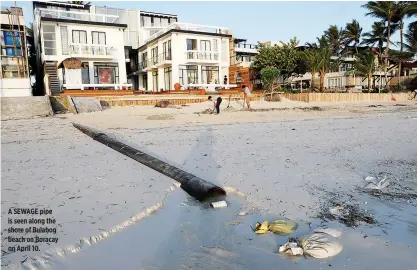  ??  ?? A SEWAGE pipe is seen along the shore of Bulabog beach on Boracay on April 10.