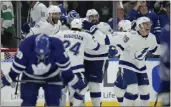  ?? FRANK GUNN — THE CANADIAN PRESS VIA AP ?? Tampa Bay players celebrate Saturday after defeating Toronto in Game 7 of their first-round playoff series.