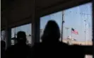  ??  ?? A US flag is pictured at MatamorosB­rownsville internatio­nal border bridge, as seen from Matamoros, Mexico, on 19 February. Photograph: Daniel Becerril/Reuters