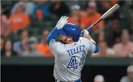  ?? AP PHOTO ?? Toronto Blue Jays player Rowdy Tellez follows through on a grand slam against the Baltimore Orioles during the fifth inning of a game on Wednesday in Baltimore.