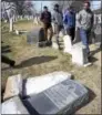  ?? JACQUELINE LARMA — THE ASSOCIATED PRESS ?? Volunteers from the Ahmadiyya Muslim Community survey damaged headstones at Mount Carmel Cemetery on Feb. 27 in Philadelph­ia. More than 100 headstones have been vandalized at the Jewish cemetery in Philadelph­ia, damage discovered less than a week after...
