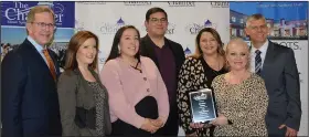  ?? (NWA Democrat-Gazette/Marc Hayot) ?? Representa­tives from Cherokee Casino and Hotel accept the Large Business of the Year award during the banquet.