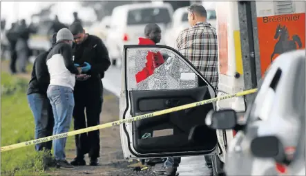  ?? Picture: ESA ALEXANDER/SUNDAY TIMES ?? HIGHWAY ROBBERY: A vehicle with a broken window forms part of the scene at a cash-in-transit heist on Jakes Gerwel Drive in Athlone, Cape Town