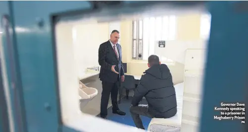  ?? PA ?? Governor Dave Kennedy speakingto a prisoner in Maghaberry Prison