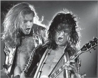  ?? Los Angeles Times ?? AIN’T TALKIN’ ’ BOUT LOVE
Singer David Lee Roth, left, and Eddie Van Halen were fruitful collaborat­ors with a famously tempestuou­s relationsh­ip. Roth split from Van Halen in 1985.