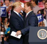  ?? JOHN LOCHER / ASSOCIATED PRESS FILE (2018) ?? Then-president Donald Trump, left, embraces then-sen. Dean Heller, R-nev., during a campaign rally Sept. 20, 2018, in Las Vegas.